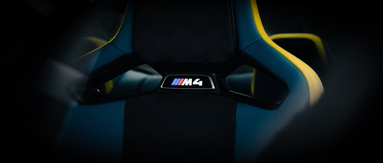 bmw m4 racing bucket close up shot of m4 badge at morendi showroom in vilnius lithuania