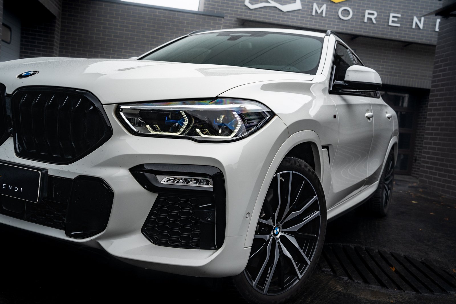 bmw x6 m50i exterior close up shot of front headlight at morendi tuning