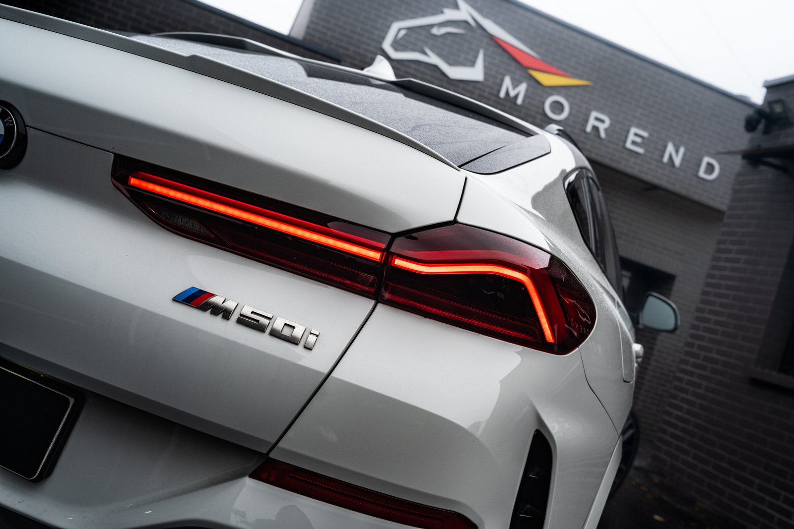 bmw x6 m50i back close up shot of lights and badge in vilnius lithuania