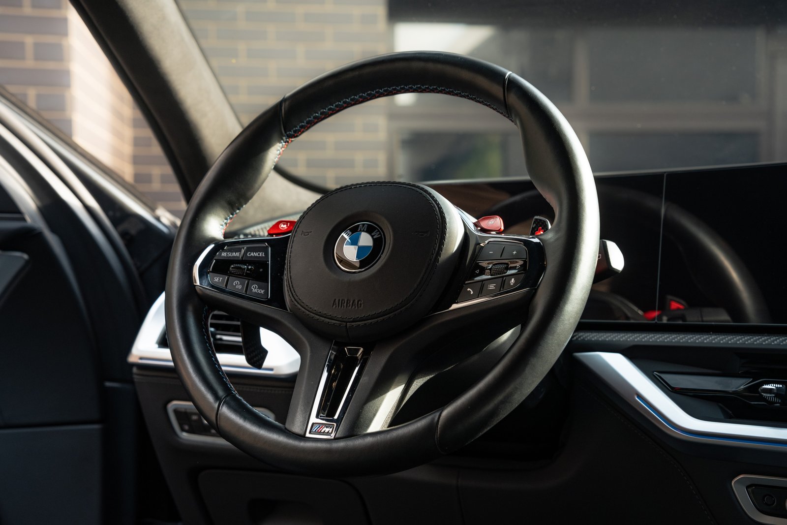 bmw xm new close up shot of the steering wheel in morendi backyard located in vilnius lithuania