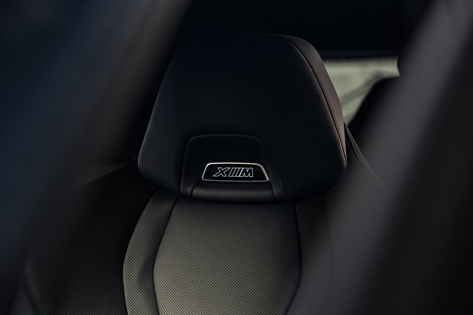 bmw xm new close up shot of the seat badge in morendi backyard vilnius lithuania