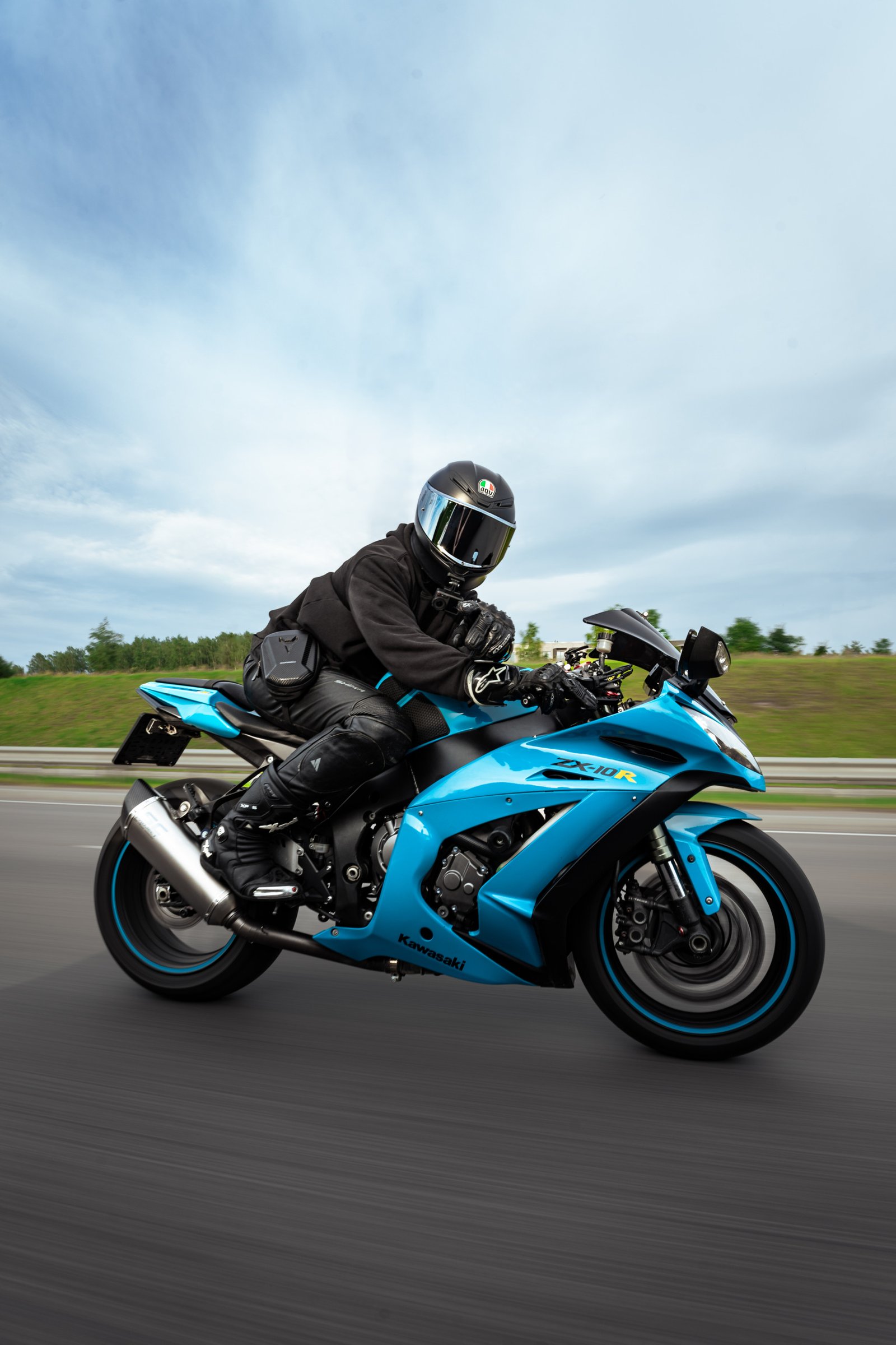 kawasaki zx10r roller shot fast paced driver pointing at camera in vilnius lithuania