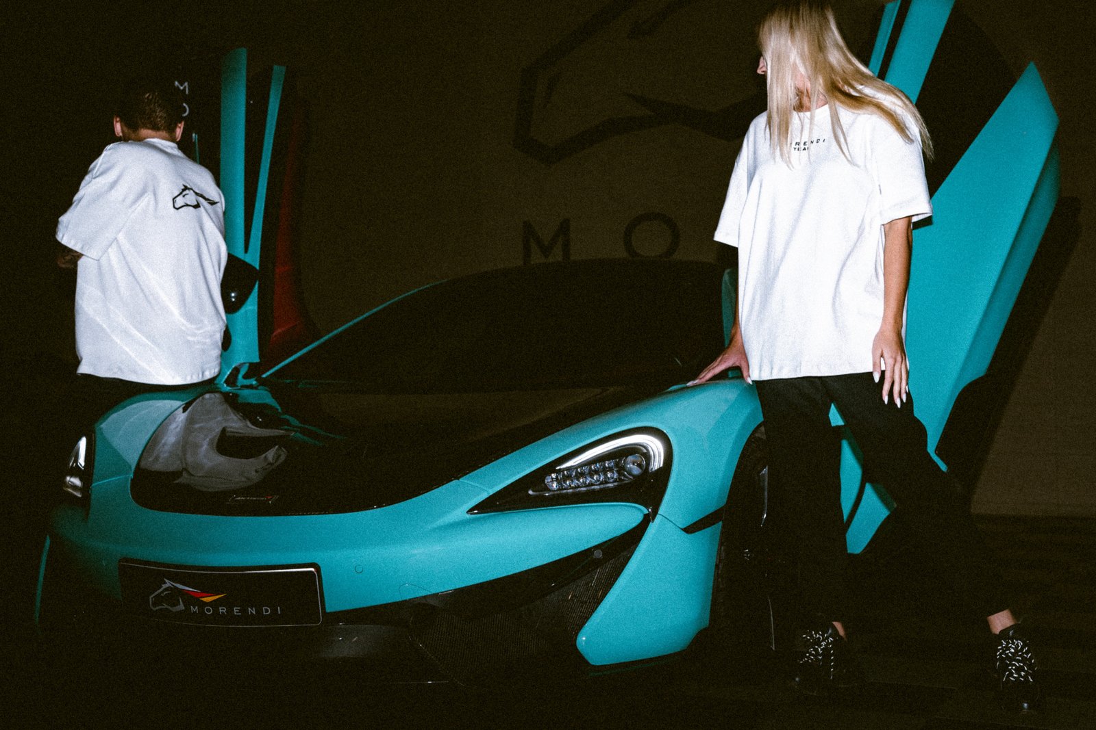 mclaren 570gt tiffany blue white shirt photoshoot in morendi showroom vilnius lithuania