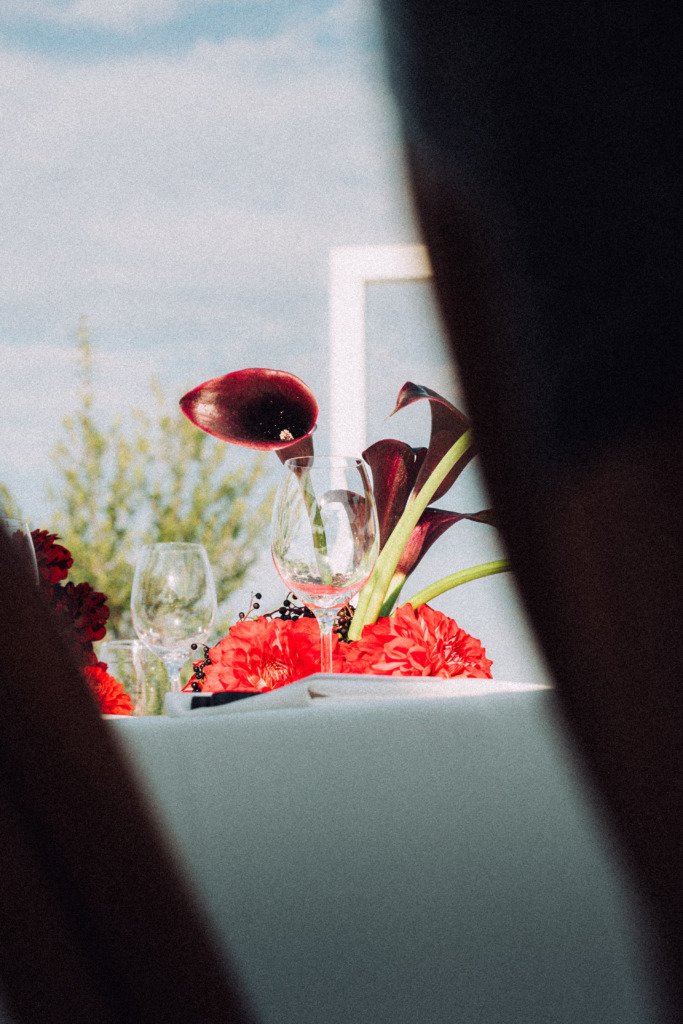 Wedding reception red flower decor in vilnius oldtown