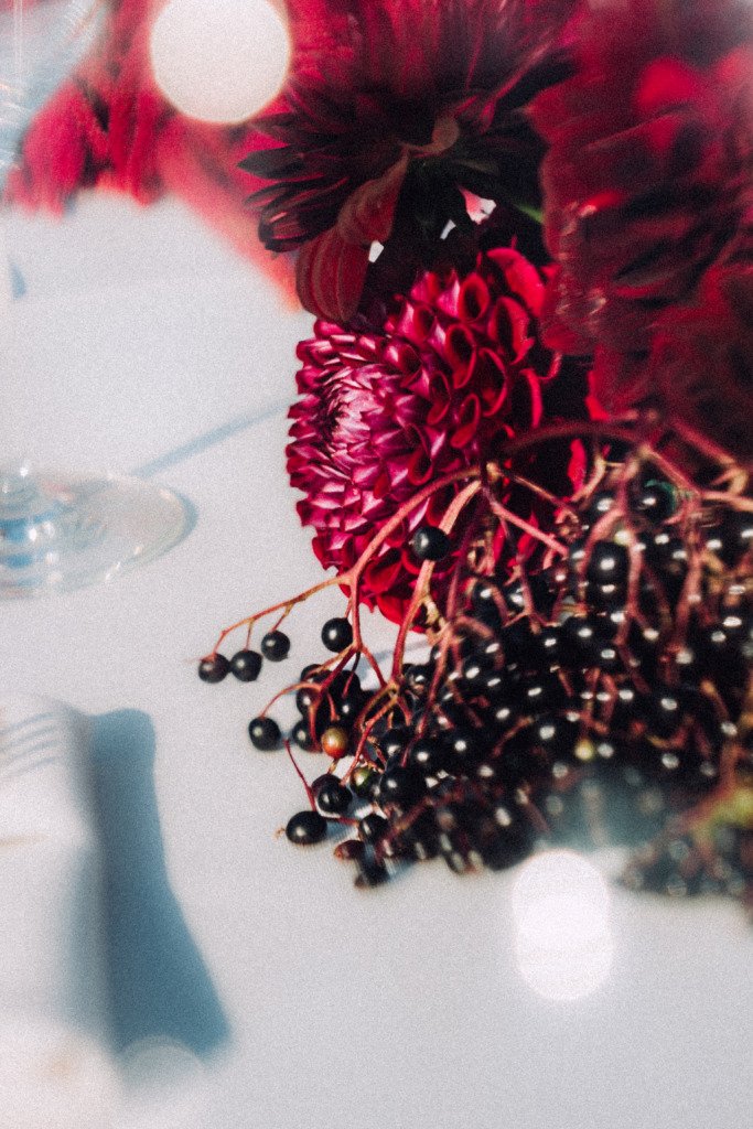 Red flower wedding reception table close up decor vilnius