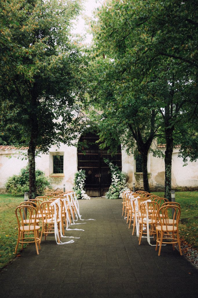 Wedding ceremony decor with chairs flowers in pazaislio vienuolynas kaunas lithuania