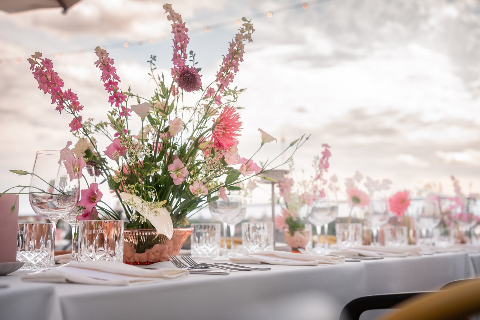 Pink wedding flower decor in vilnius rooftop