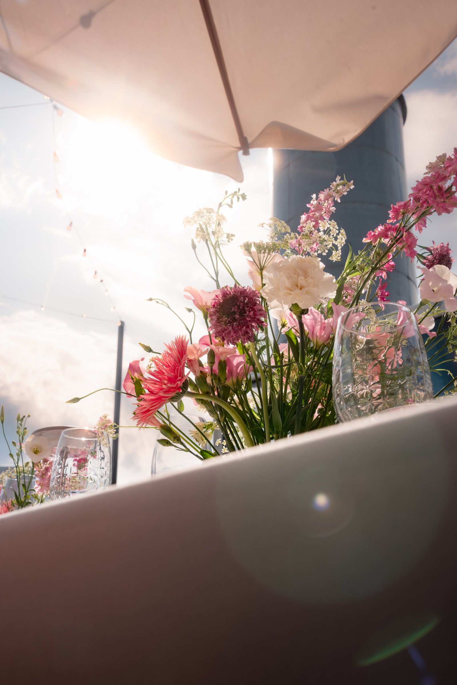 Pink wedding reception table flower decor in vilnius oldtown rooftop lithuania